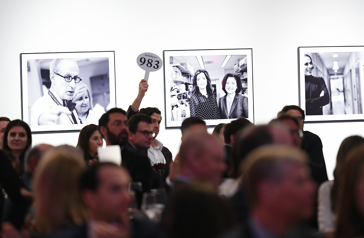 MRA Board Member Ben Black raises paddle at MRA’s Sotheby’s Gala.