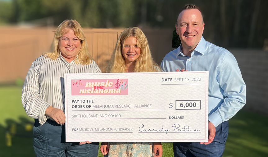 Cassidy Battin presents check to MRA CEO Dr. Marc Hurlbert and President & COO Stephanie Kauffman